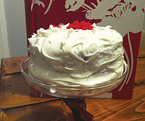 red velvet cake covered in white frosting