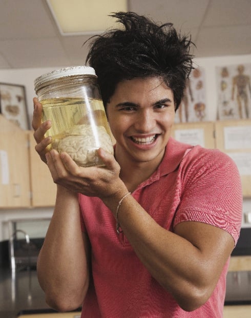 teen holding a brain in a jar, for article on adolescent brains