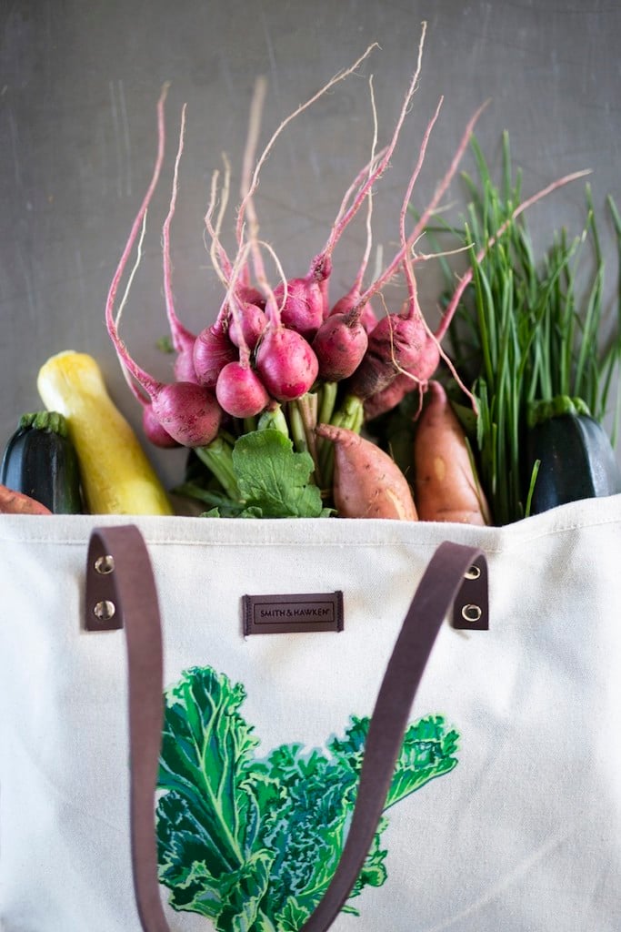 a canvas bag full of fresh produce, for article on kids and farmer's markets