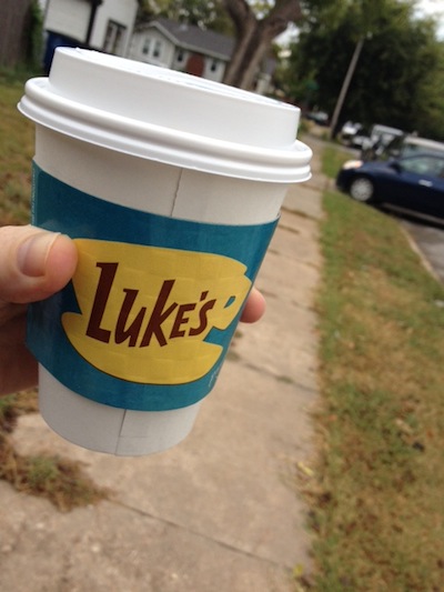 betty casey holds a cup from luke's diner, from gilmore girls
