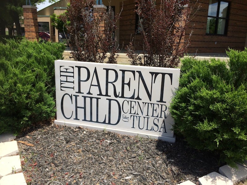 a sign designating the parent child center of tulsa