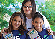 two tulsa girl scouts and a woman smiling