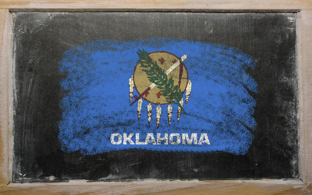 oklahoma flag on chalkboard. for article on high-stakes testing