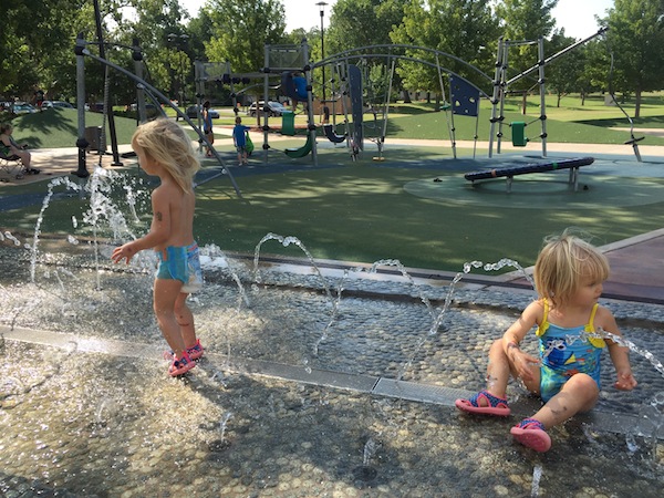 blythe and reese play at the 41st and riverside splash pad
