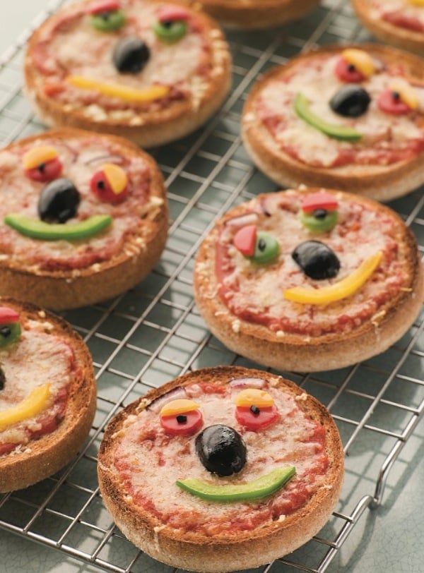 english muffin pizzas decorated with faces, for list of quick dinner ideas