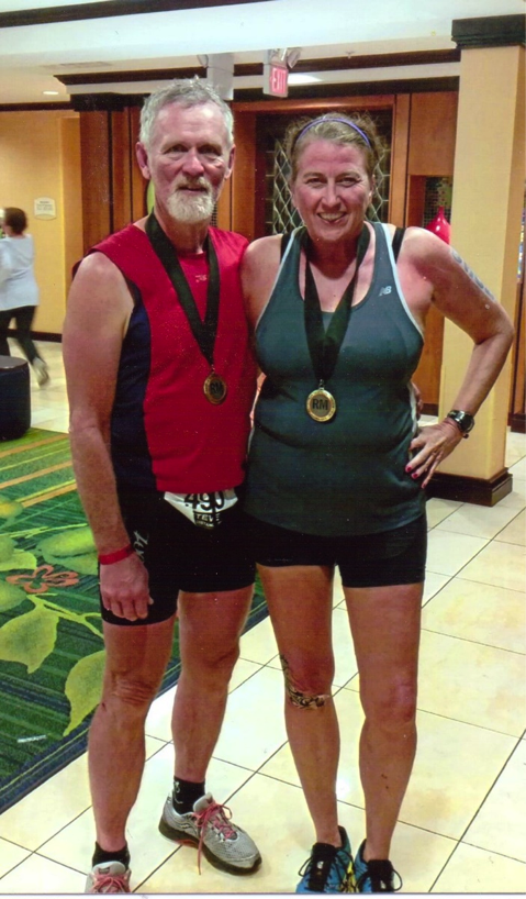 steve webb and diane morrow kondos with medals after an athletic competition, for article on building a bucket list
