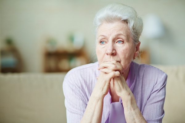 an elderly woman looking concerned, for article on grandparents and divorce