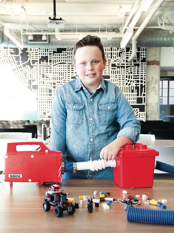 gabe dougherty, youth winner of the 2016 tulsa startup series, with his lego vaccuum