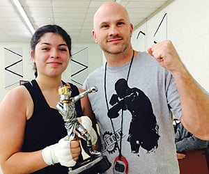 Deicy Bencomo with her boxing coach. for article on teens and boxing