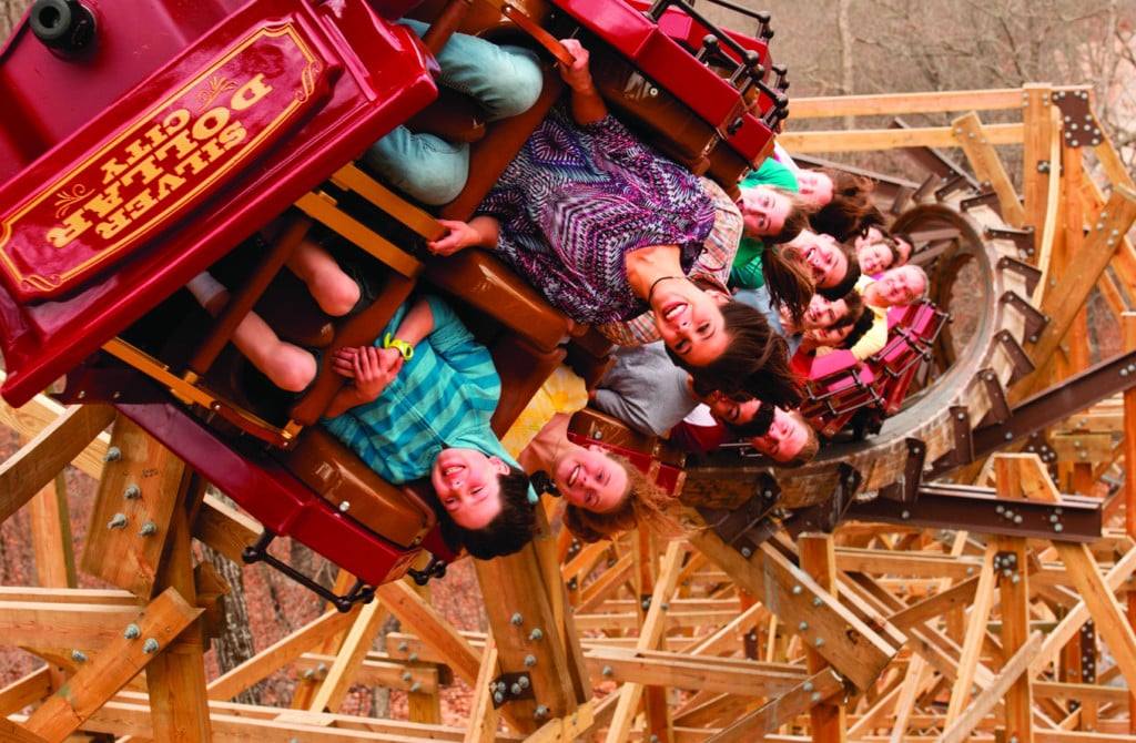 people riding a roller coaster at silver dollar city