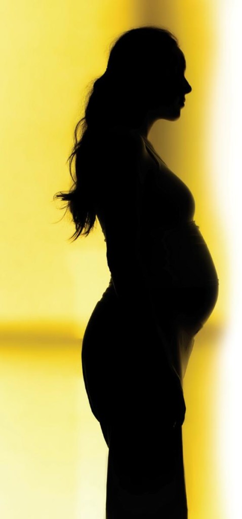 sillouhette of pregnant woman, for article on pregnancy and heartburn