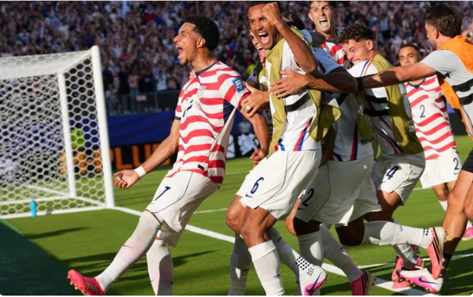 United States' Malik Tillman (17) celebrates with teammates after scoring on a free kick during the World Cup round of 32 soccer match on July 1, 2026. Martin Meissner /AP Photo