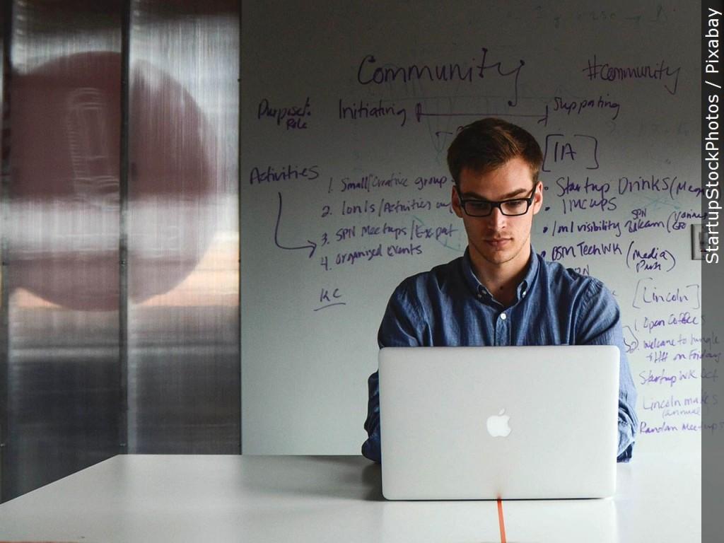 Man Working At An Office Computer