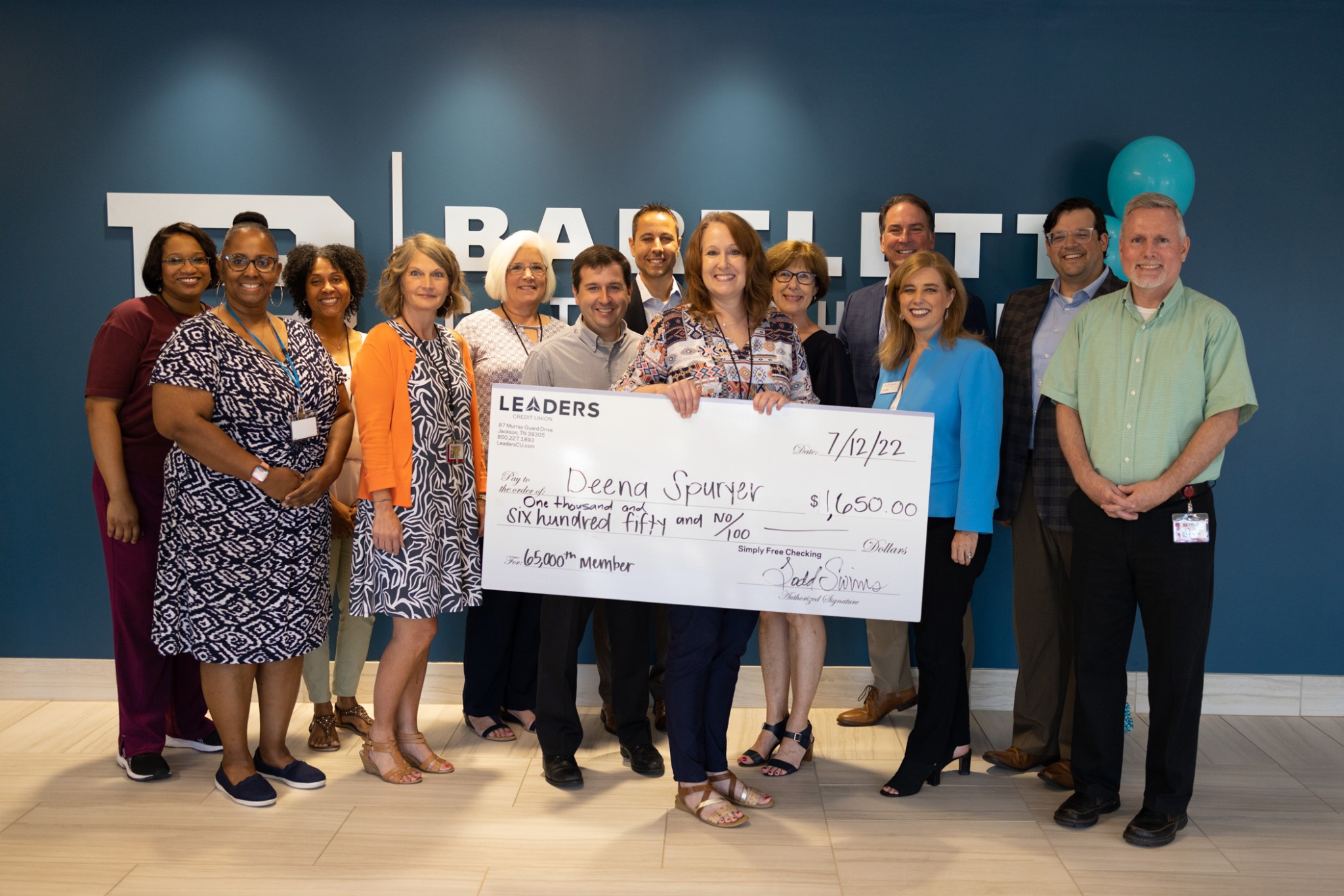 Leaders Credit Union celebrates 65 years, presents new member with