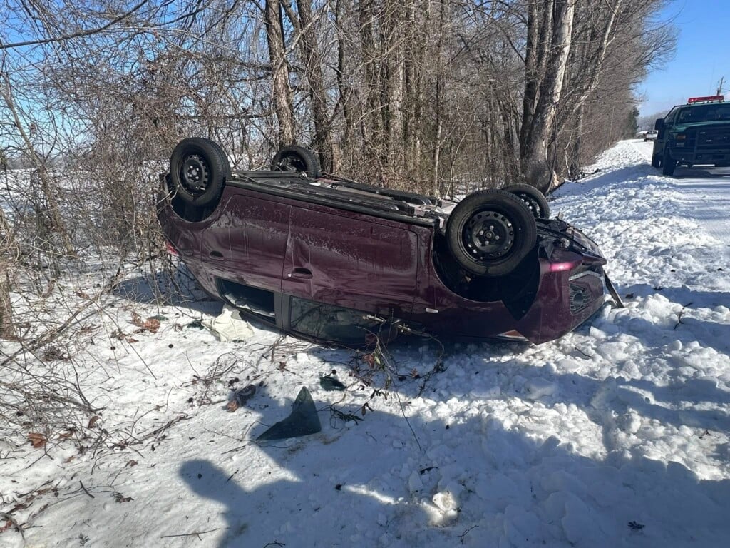 Wrecked car on snow covered roads