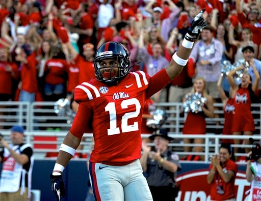 Mississippi wide receiver Donte Moncrief (12) points to the crowd after scoring on a 55-yard touchdown during the first quarter of an NCAA college football game in Oxford