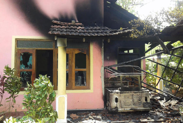 A house stands vandalized in racial violence near Galle