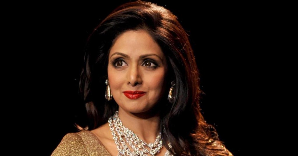 Indian Bollywood film actress Sridevi presents a creation during the India International Jewellery Week 2014 (IIJW) in Mumbai on July 16
