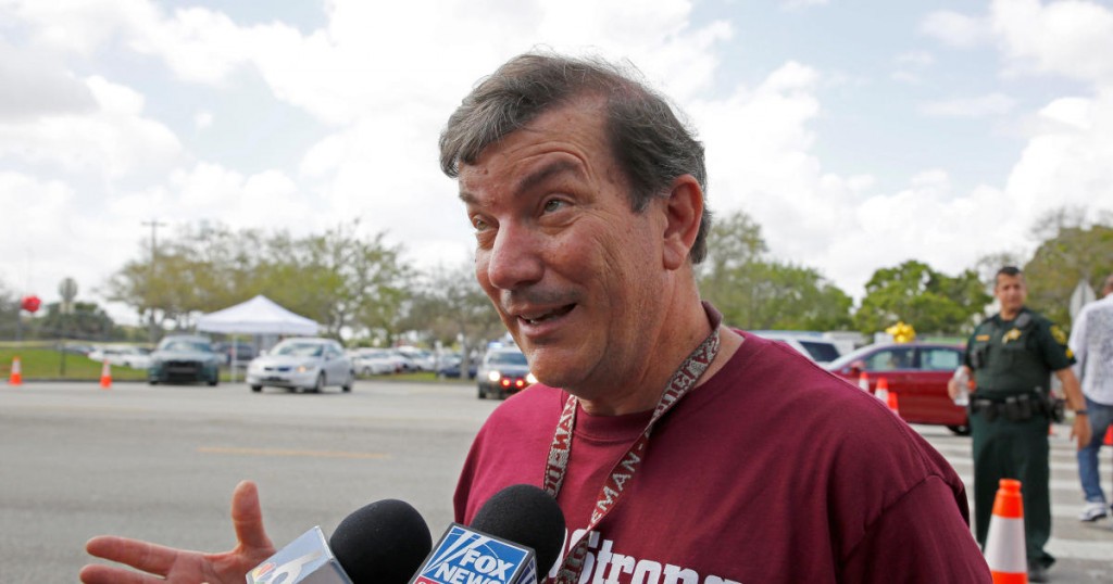 Mathematics teacher Jim Gard speaks with reporters at Marjory Stoneman Douglas High School in Parkland