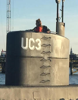 This photo shows allegedly Swedish journalist Kim Wall standing in the tower of the private submarine "UC3 Nautilus" on August 10