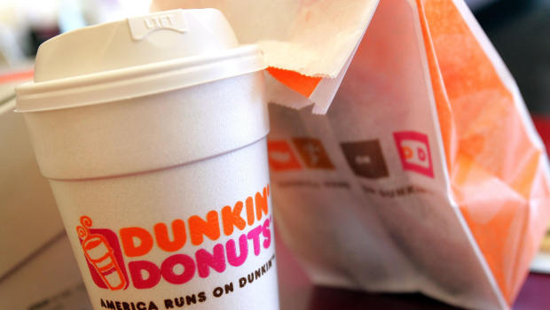 CHICAGO - SEPTEMBER 07:   A cup of Dunkin' Donuts coffee and a donut bag sit on a counter September 7