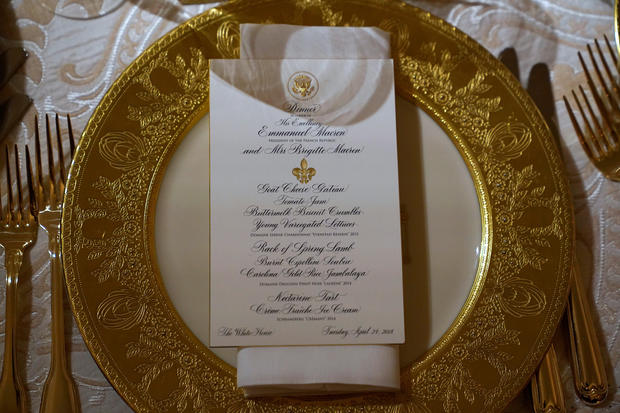 A place setting for the State Dinner for French President Emmanuel Macron is shown in the State Dining Room of the White House in Washington