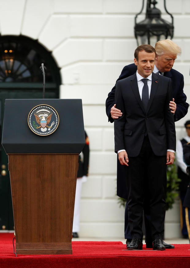 U.S. President Donald Trump and French President Emmanuel Macron attend an arrival ceremony at the White House in Washington