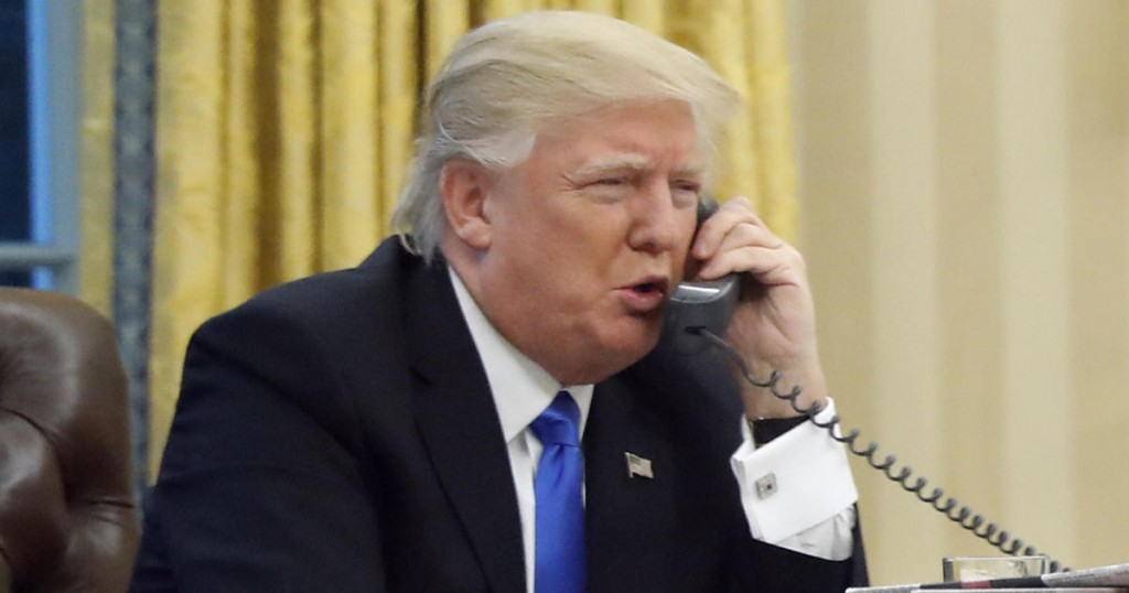 U.S. President Donald Trump speaks on the phone with Prime Minister of Australia Malcolm Turnbull in the Oval Office of the White House