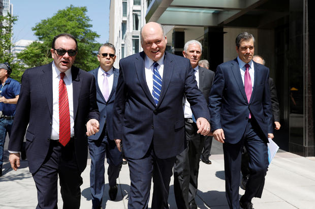 Ford CEO James Hackett with senior executives from U.S. and foreign automakers walk from Daimler Chrysler to the White House for a meeting with U.S. President Donald Trump in Washington