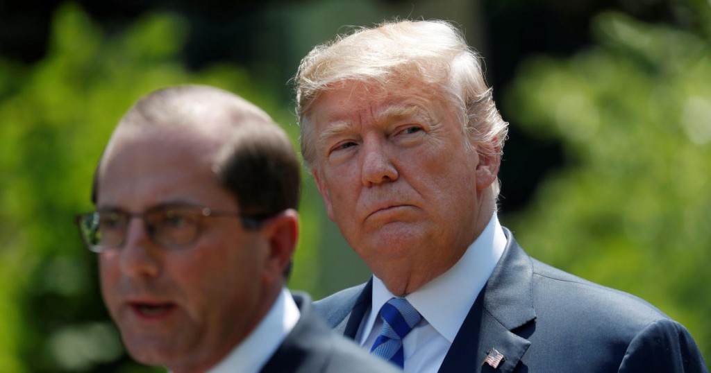 U.S. President Donald Trump listens to Health and Human Services Secretary Alex Azar speak about lowering drug prices from the Rose Garden at the White House in Washington