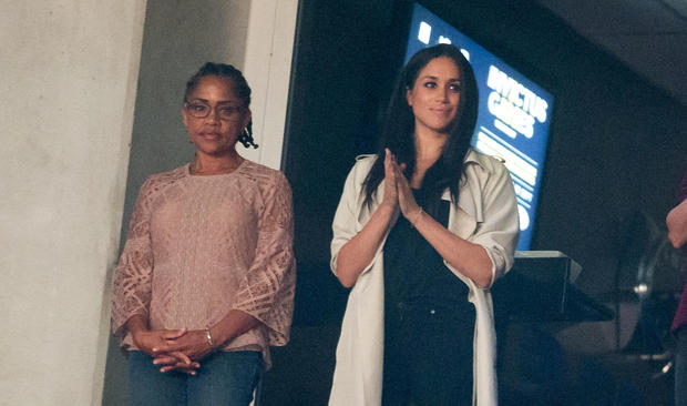 Meghan Markle (C) and her mother Doria Ragland (L) watch the closing ceremonies for the Invictus Games in Toronto