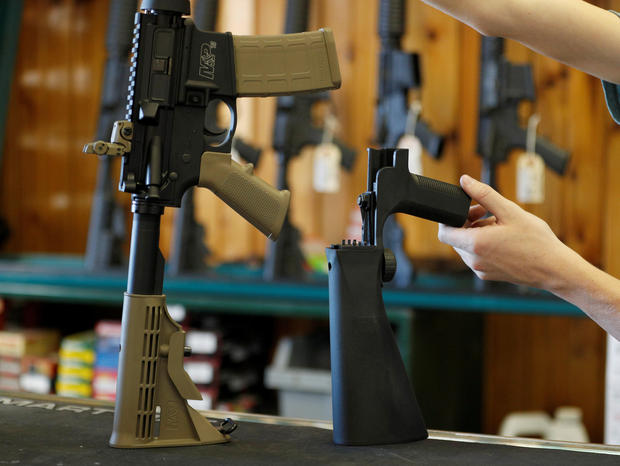 A bump fire stock that attaches to a semi-automatic rifle to increase the firing rate is seen at Good Guys Gun Shop in Orem 