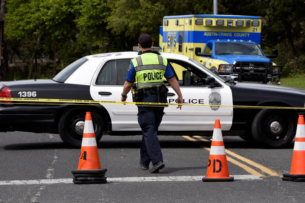 REFILE - CORRECTING THE NAME OF THE STREET Members of Austin Police Department block off part of Republic of Texas Boulevard following an explosion in Austin