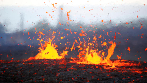 Lava erupts from a fissure on the outskirts of Pahoa during ongoing eruptions of the Kilauea Volcano in Hawaii