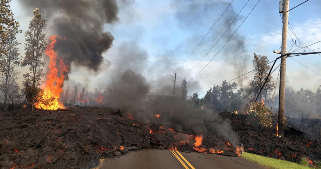 Lava advances along a street near a fissure in Leilani Estates