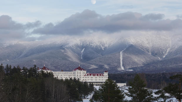 "Mount Washington serves as a majestic winter setting for a large resort hotel photographed at dusk. Deep ravines and the Cog Railway are notable features. Mount Washington is 6288 feet in elevation and has recorded the most severe weather in the Eastern U.S.A. Worldaas highest wind speed was recorded on Mt. Washington at 231 MPH.Canon EOS 1D Mark III