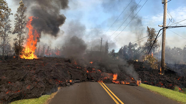 Lava advances along a street near a fissure in Leilani Estates