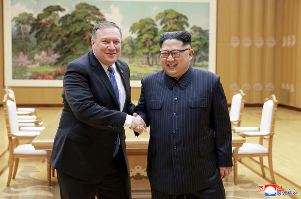 North Korean leader Kim Jong Un shakes hands with U.S. Secretary of State Mike Pompeo in this May 9