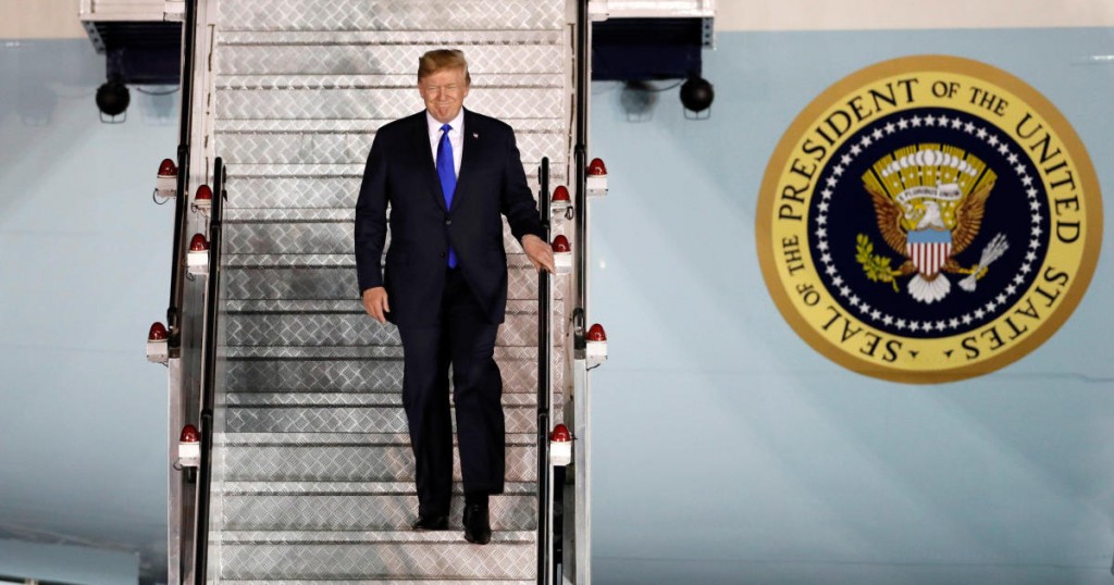 U.S. President Donald Trump steps off his plane as he arrives at Paya Lebar Air Base in Singapore