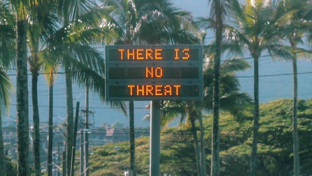 An electronic sign reads "There is no threat" in Oahu