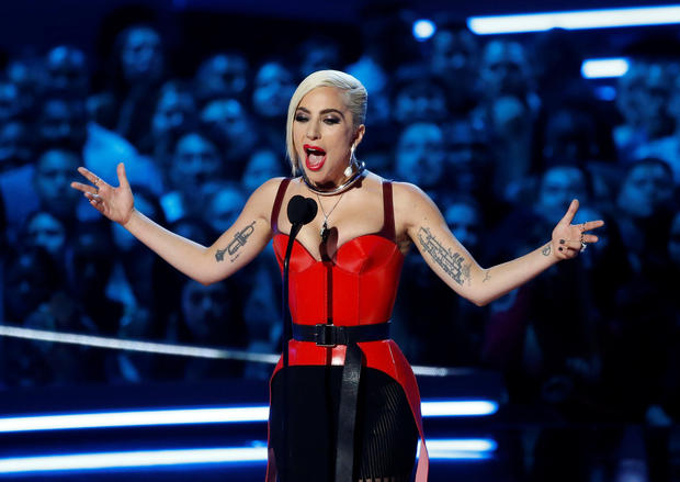 Singer Lady Gaga speaks on stage at the 2018 MTV Movie & TV Awards at Barker Hangar in Santa Monica
