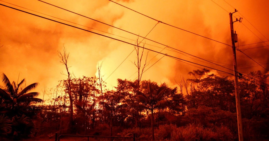 Lava illuminates the sky above Leilani Estates during ongoing eruptions of the Kilauea Volcano in Hawaii
