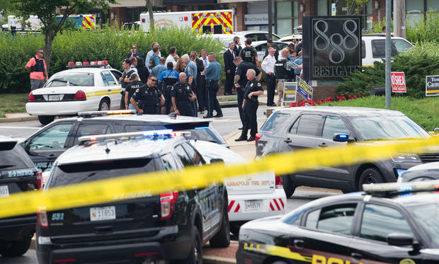 Police respond to a shooting at the offices of the Capital Gazette