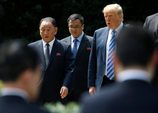 North Korean envoy Kim Yong Chol talks with U.S. President Donald Trump as they walk out of the Oval Office after a meeting at the White House in Washington