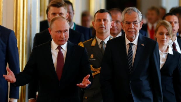Austria's President Alexander Van der Bellen welcomes Russia's President Vladimir Putin in his office in Vienna
