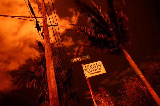 Lava illuminates a sign in Leilani Estates 