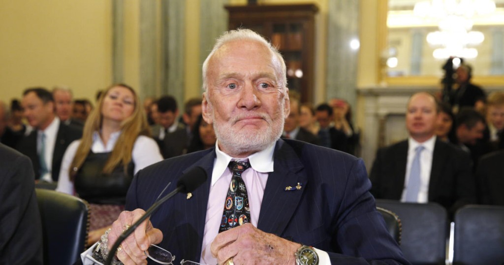 Former astronaut Buzz Aldrin takes his seat to testify before a Senate Subcommittee on Space