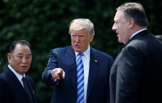 North Korean envoy Kim Yong Chol talks with U.S. President Donald Trump as Secretary of State Mike Pompeo looks on after a meeting at the White House in Washington