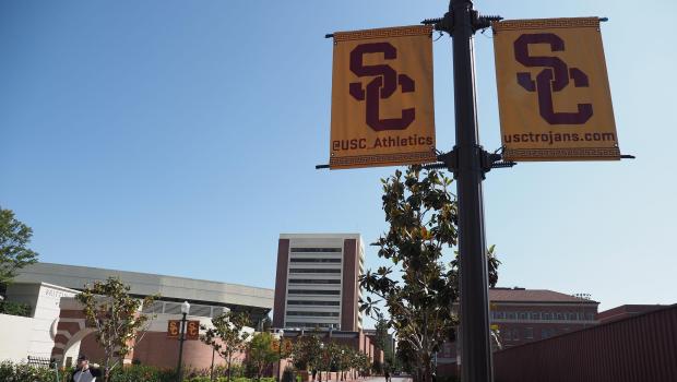 A young man rides a bicycle on the campus of the University of Southern California (USC) in Los Angeles