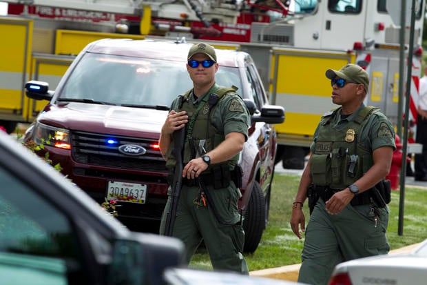 Maryland police officers patrol the area after multiple people were shot at at The Capital Gazette newspaper in Annapolis